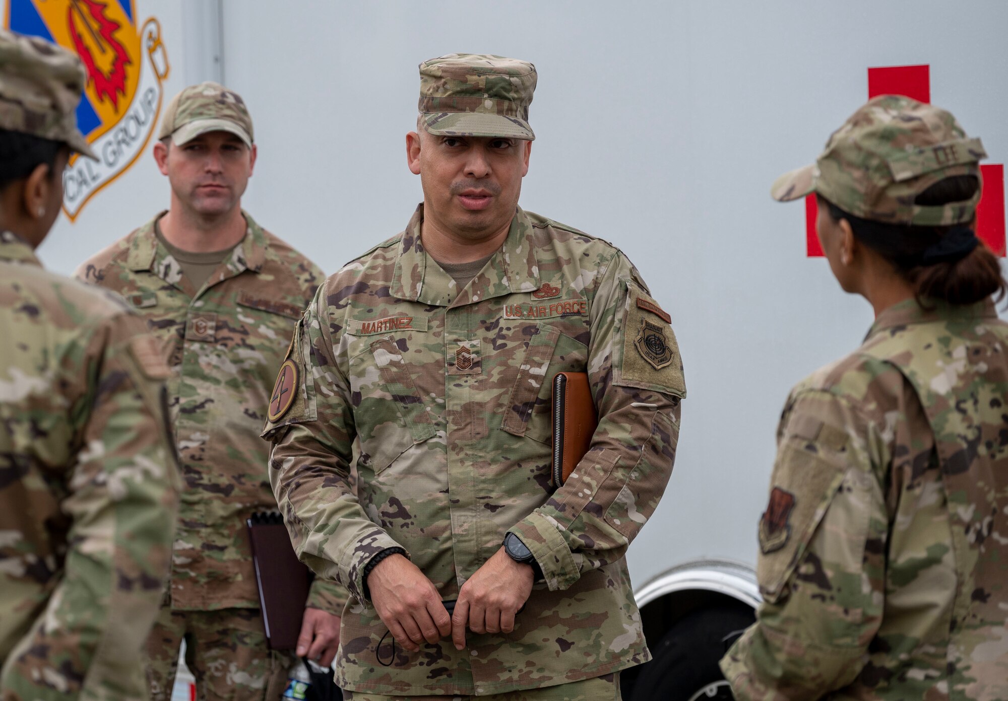 Chief Master Sgt. Peter Martinez, 4th Fighter Wing command chief, speaks with Airmen assigned to the 4th Medical Group during a visit with Chief Master Sgt. Sonia Lee, 15th Air Force command chief, at Seymour Johnson Air Force Base, North Carolina, Nov. 15, 2022. The 15th AF advocates for and provides direct support to their subordinate wings to enhance combat readiness in support of lead wing objectives. (U.S. Air Force photo by Airman 1st Class Sabrina Fuller)