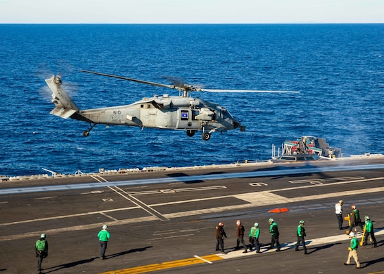 An MH-60S Nighthawk helicopter, attached to Helicopter Sea Combat Squadron (HSC) 5, takes off from the flight deck of the Nimitz-class aircraft carrier USS George H.W. Bush (CVN 77), Nov. 11, 2022.