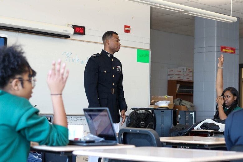 U.S. Marine Corps Capt. Richmond Jackson, an information system security manager for the Marine Corps Recruiting Command, answers Cass Technical High School student’s questions in Detroit, Mich., Nov. 2, 2022. With no support on his education while growing up, Jackson defied all odds and created a successful career within the Marine Corps. (Marine Corps photo by Cpl. Austin Fraley)
