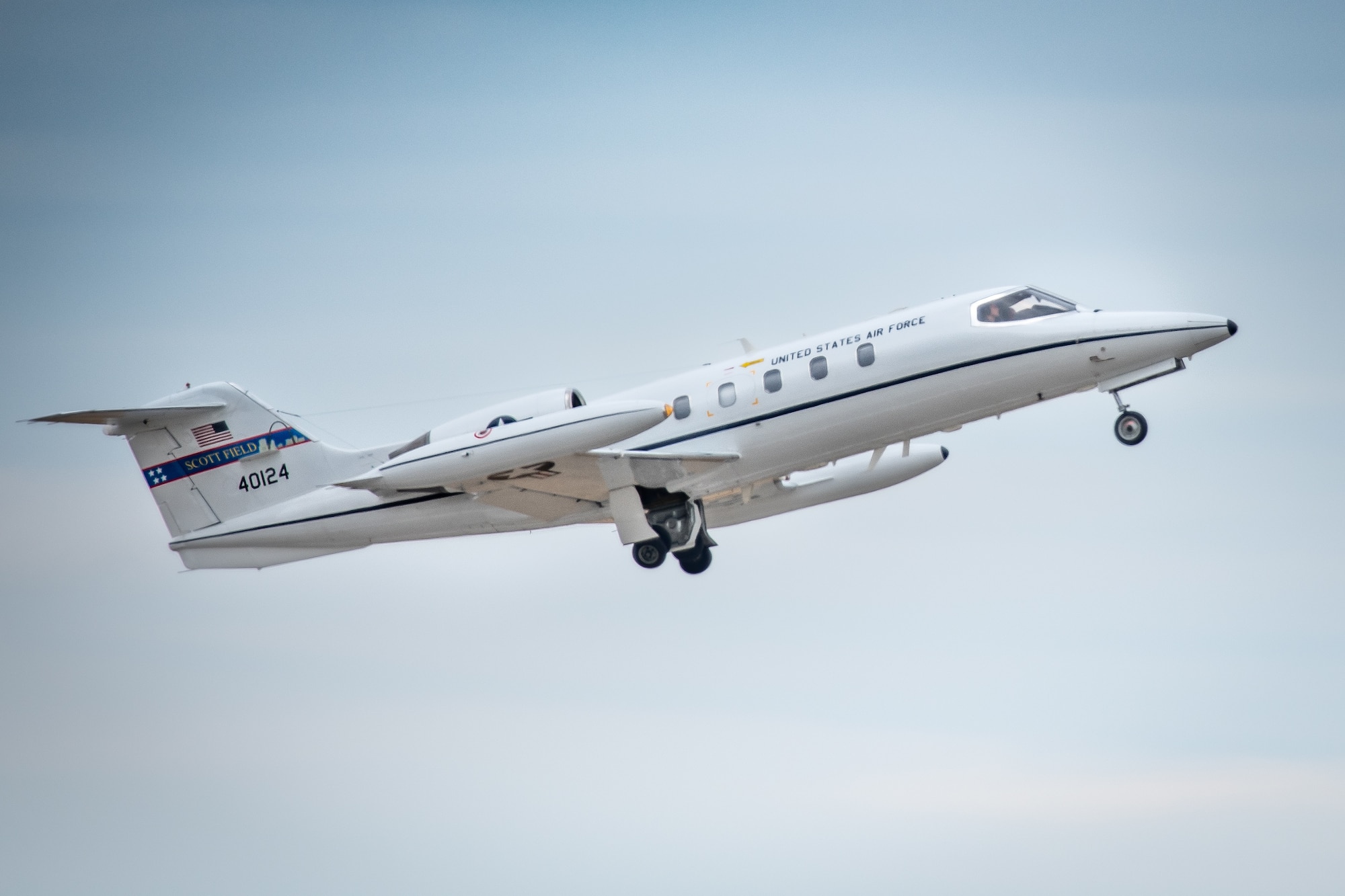 A U.S. Air Force C-21 Cougar assigned to the 458th Airlift Squadron takes off over Scott Air Force Base, Ill., Feb 26, 2021. The C-21 is used as an instrument of diplomacy, transporting general officers and other high ranking government officials to locations all around the world and is supported by the Air Force Life Cycle Management Center's Presidential and Executive Airlift Directorate. (U.S. Air Force photo by 1st Lt. Sam Eckholm)