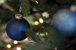 Pictured here are two blue ornaments on a holiday tree at Coast Guard Headquarters in Washington, D.C., Dec. 19, 2018. Many units around the Coast Guard put up holiday decorations to boost help boost morale and show holiday spirit. (U.S. Coast Guard photo by Petty Officer 2nd Class Jasmine Mieszala)
