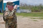 Brig. Gen. Christopher Mohan, commanding general of the 3RD Expeditionary Sustainment Command in Fort Bragg, North Carolina, drinks a bottle of purified water from the Reverse Osmosis Water Purification Unit at the Roosevelt Roads water station in Puerto Rico, October 14. For survivors of Hurricane Maria who do not have access to clean, usable water, a multipronged approach is in place to ensure potable water is available to all residents. (U.S. Army photo by: Sgt. Michael Eaddy)