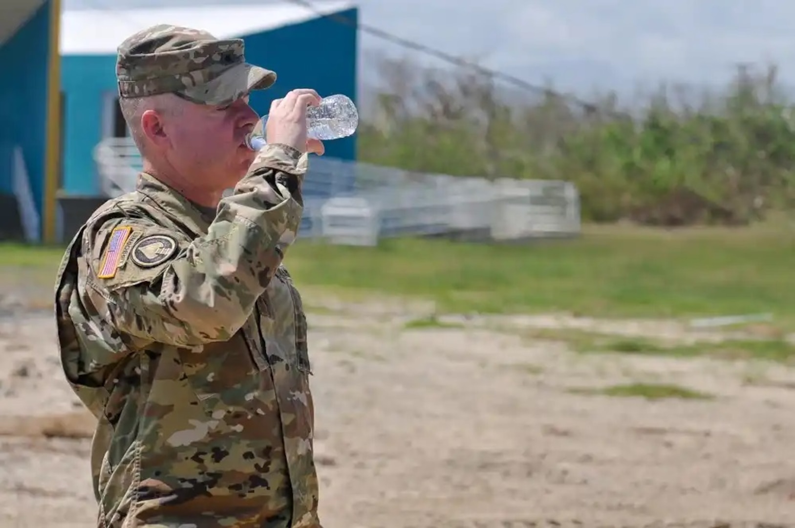 Brig. Gen. Christopher Mohan, commanding general of the 3RD Expeditionary Sustainment Command in Fort Bragg, North Carolina, drinks a bottle of purified water from the Reverse Osmosis Water Purification Unit at the Roosevelt Roads water station in Puerto Rico, October 14. For survivors of Hurricane Maria who do not have access to clean, usable water, a multipronged approach is in place to ensure potable water is available to all residents. (U.S. Army photo by: Sgt. Michael Eaddy)