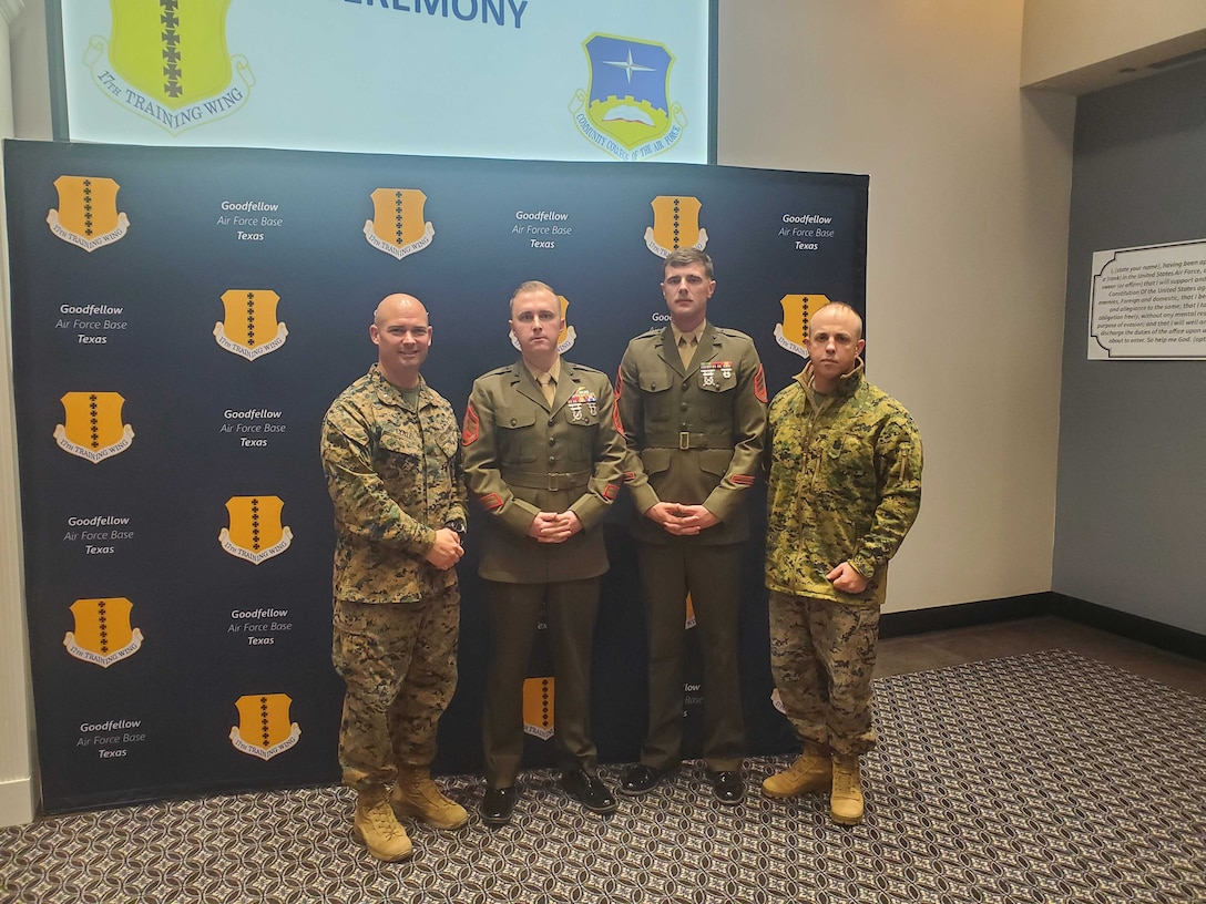 U.S. Marine Corps Detachment Goodfellow Air Force Base Commanding Officer Lieutenant Colonel Thomas Coyle and Senior Enlisted Advisor Master Gunnery Sergeant Derry Cross congratulate Staff Sergeant Samuel McManus and Staff Sergeant Zane Scott, Marine Corps Detachment Goodfellow instructors, after presentation of a diploma from the Community College of the Air Force, presented by U.S. Air Force Colonel Matthew Reilman, 17th Training Wing commander, at the CCAF graduation in the Powell Event Center, Goodfellow Air Force Base, Texas, Nov. 16, 2022. Unique to the 17th TRW, joint service members may attend and even graduate from the CCAF. (U.S. Air Force photo by Airman 1st Class Sarah Williams)