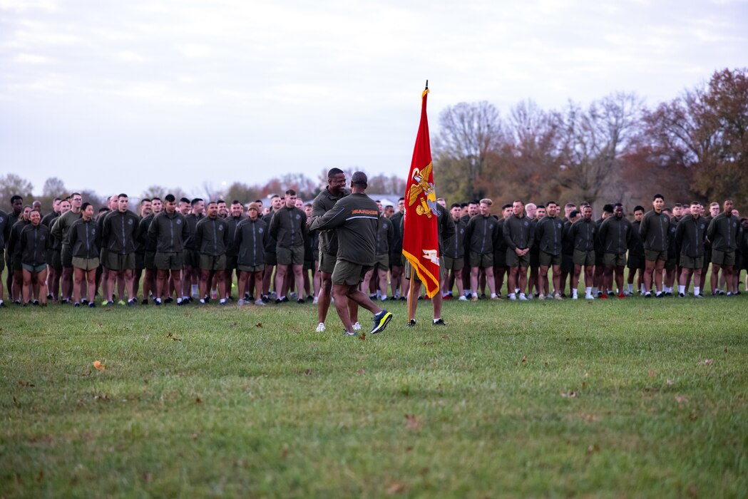 U.S. Marine Corps Col. Michael L. Brooks, base commander, Marine Corps Base Quantico, front, and 1st Sgt. Orlando Freeman, first sergeant, Headquarters Company, Security Battalion, greet each other before a motivational run honoring the Marine Corps’ 247th birthday on Marine Corps Base Quantico, Virginia, Nov. 10, 2022. Each year, Marines come together to celebrate the birthday with ceremonies that recall the history of the Corps and enhance the camaraderie shared across generations of Marines. (U.S. Marine Corps photo by Lance Cpl. Joaquin Dela Torre)