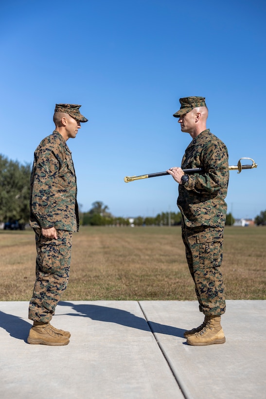 U.S. Marine Corps Lt. Col. William T. Kerrigan, commanding officer of 1st Battalion, 8th Marine Regiment, appoints Sgt. Maj. Daniel R. Lassett as the sergeant major of 1st Battalion, 8th Marine Regiment at Camp Lejeune, North Carolina, Nov. 8, 2022. This appointment symbolizes the transfer of authority, responsibility, and accountability of the Marines and Sailors under his charge. (U.S. Marine Corps photo by Staff Sgt. Rodion Zabolotniy)