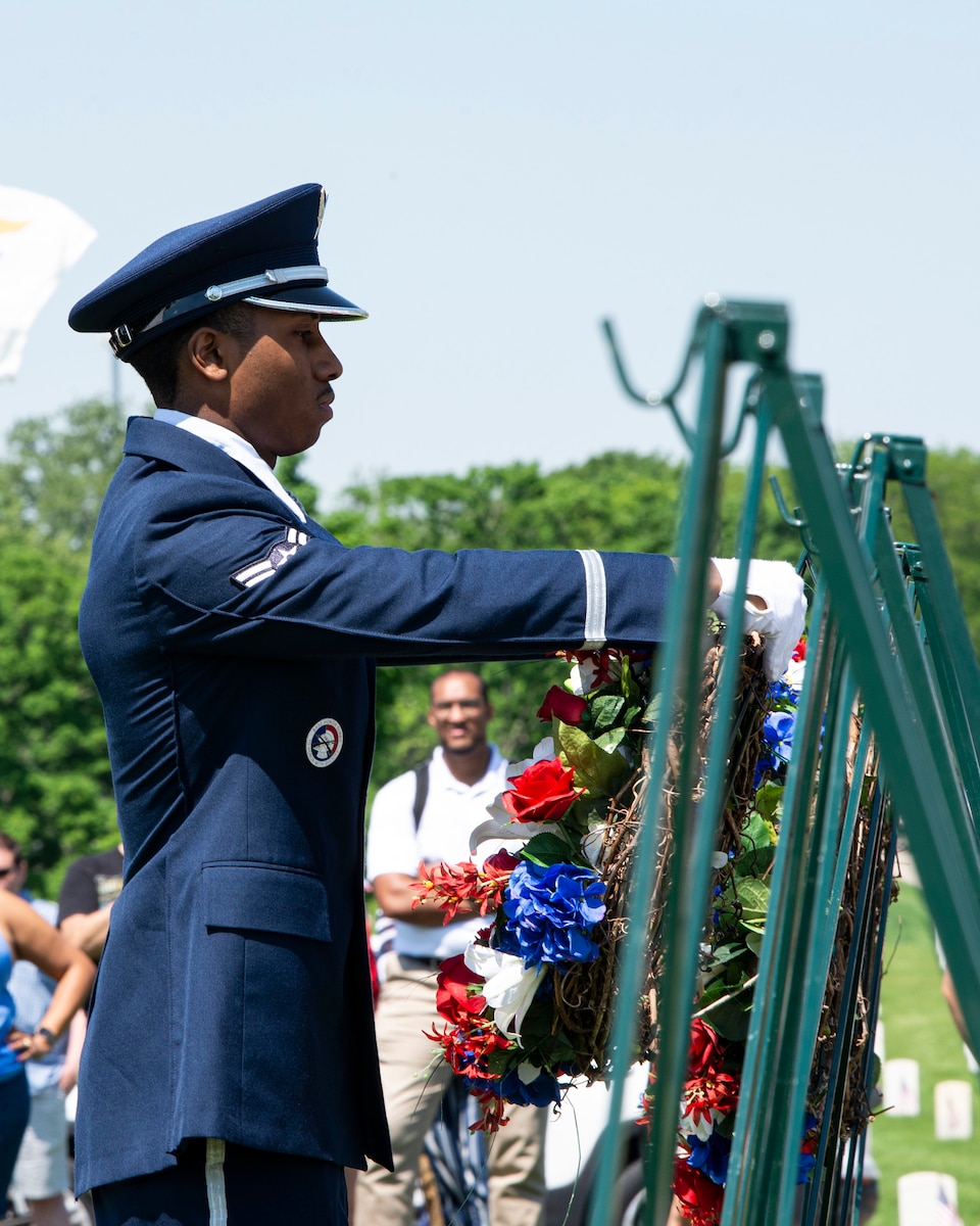 Airman lays wreath.