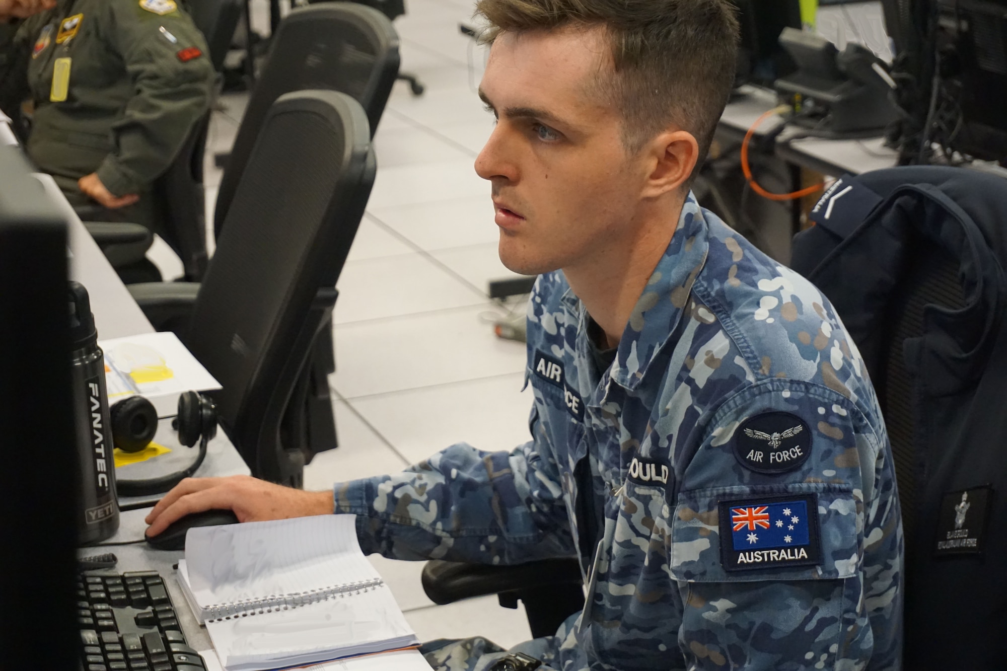 military members working at computers