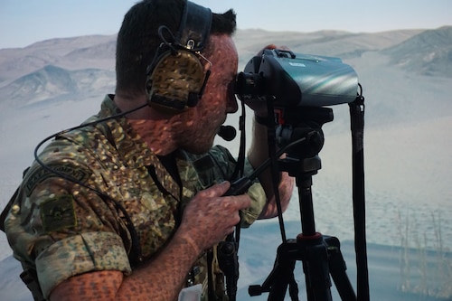 military member using binoculars in virtual environment