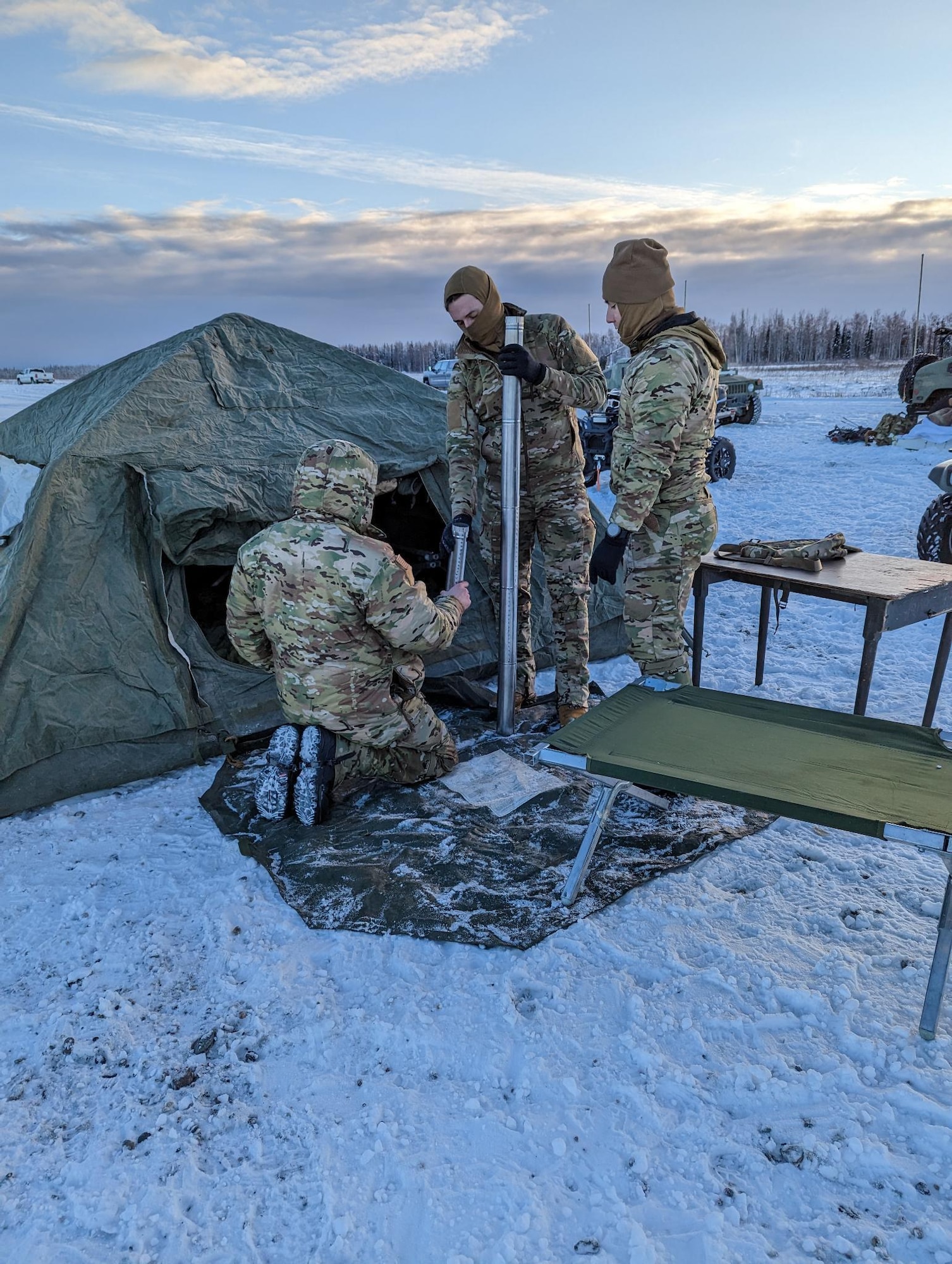 Airmen build a tent