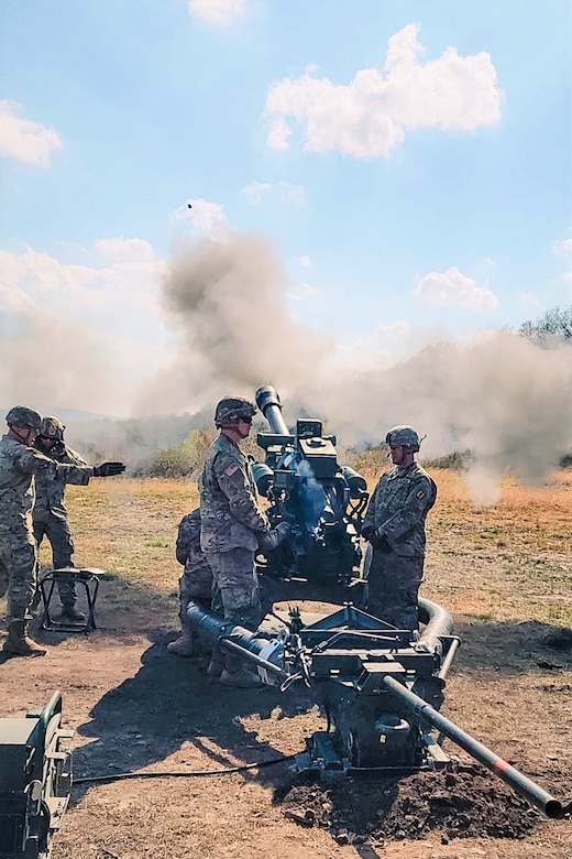 Soldiers taking the cannon crewmember Military Occupation Specialty – Transition and Advanced Leaders courses at the 166th Regiment Regional Training Institute conduct field artillery live-fire training at Fort Indiantown Gap, Pa., on May 2, 2022.