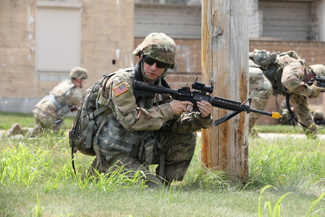 Staff Sgt. Kyler Saxon (center) and other Soldiers with the 160th Engineer Company, Delaware Army National Guard train on reacting to threats while on patrol including IEDs July 12 as part of their preparations for an upcoming deployment. This training is part of the company’s annual training that they are conducting at Fort Indiantown Gap, Pa.