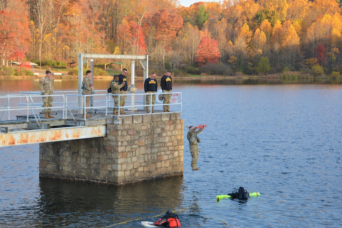 Pennsylvania National Guard Soldiers attending the Ranger Sapper Assessment Program at Fort Indiantown Gap, Pa., complete the Combat Water Survival Assessment at Marquette Lake on Oct. 28, 2022. The RSAP is designed to assess whether the Soldiers are prepared to attend the U.S. Army's Ranger or Sapper schools and to further prepare them for the schools.