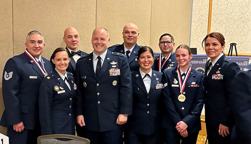 Alaska Missile Defenders of the year pose for a photo with their Air National Guard and Alaska Air National Guard leadership during the 2022 Missile Defense Advocacy Alliance Awards ceremony.  The Clear Space Force Station, Airmen and Guardians were honored amongst the MDAA awardees in Anchorage, Alaska, Nov. 5, 2022. The annual MDAA-sponsored event honors the best Air and Missile Defenders from Alaska’s Army National Guard, U.S. Air Force, U.S. Air Force Reserve Command, Alaska’s Air National Guard, and U.S. Space Force. (Courtesy Photo)