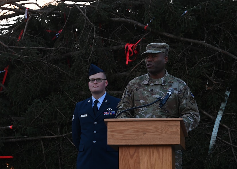Col. Todd Randolph, 316th Wing and installation commander, speaks at the Capitol Christmas Tree celebration at Joint Base Andrews, Md., Nov. 17, 2022. During the event, service members and families viewed the tree, signed well wishes on the truck banners, and walked through an interactive display about the four national forests in North Carolina. (U.S. Air Force photo by Airman 1st Class Austin Pate)