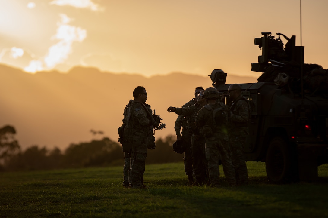 U.S. Army Soldiers from 58 Military Police Company, 25th Infantry Division, stand by for a mission during the Joint Pacific Multinational Readiness Center (JPMRC) on Helemano Military Reservation, Hi., Nov. 2, 2022. JPMRC 23-1 trains the 2nd Infantry Brigade Combat Team “Warriors”, 25th Infantry Division in realistic conditions, ensuring they are prepared for crisis or conflict. (U.S. Army photo by Spc. Kelsey Kollar)