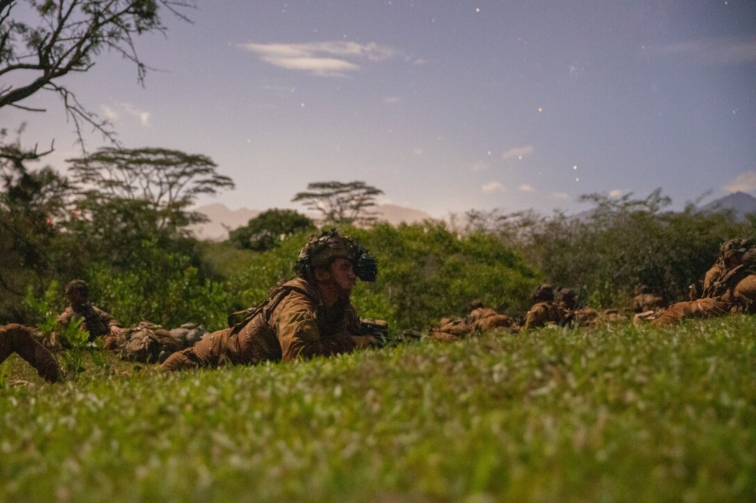 U.S. Army Soldiers from C Company 1-27 Wolfhounds, 25th Infantry Division, pull security in anticipation of an attack during the Joint Pacific Multinational Readiness Center (JPMRC) on Helemano Military Reservation, Hi., Nov. 2, 2022. JPMRC 23-1 trains the 2nd Infantry Brigade Combat Team “Warriors”, 25th Infantry Division in realistic conditions, ensuring they are prepared for crisis or conflict. (U.S. Army photo by Spc. Kelsey Kollar)