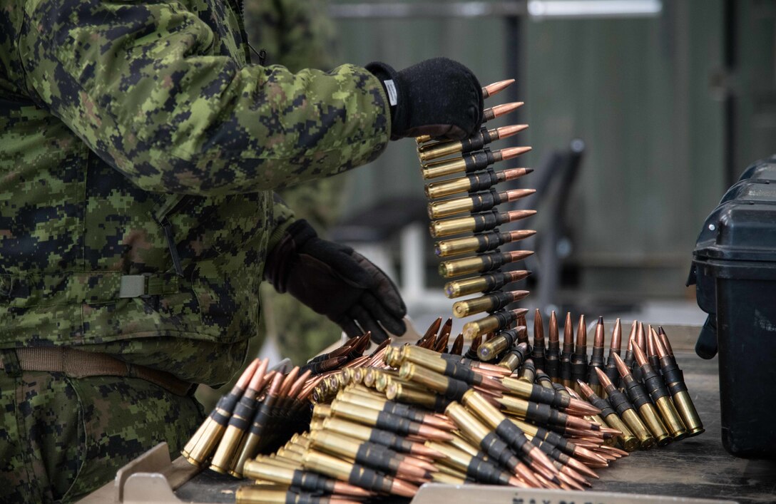 A Canadian Soldier prepares .50 caliber rounds for use on a CH146 Griffon during Joint Pacific Multinational Readiness Center 22-02 at Fort Wainwright, Alaska on February 28th, 2022.



JPMRC 22-02 is the first Regional Combat Training Center rotation in Alaska. It focuses on Large Scale Combat Operations (LSCO) and is a Cold Weather training event that includes a Situational Training Exercise (STX) and a Live Fire Exercise (LFX) in 2QFY22. This exercise will validate the 1/25th Stryker Brigade Combat Team’s Cold Weather training readiness and capabilities.



Photo credit: Corporal Angela Gore, Canadian Armed Forces