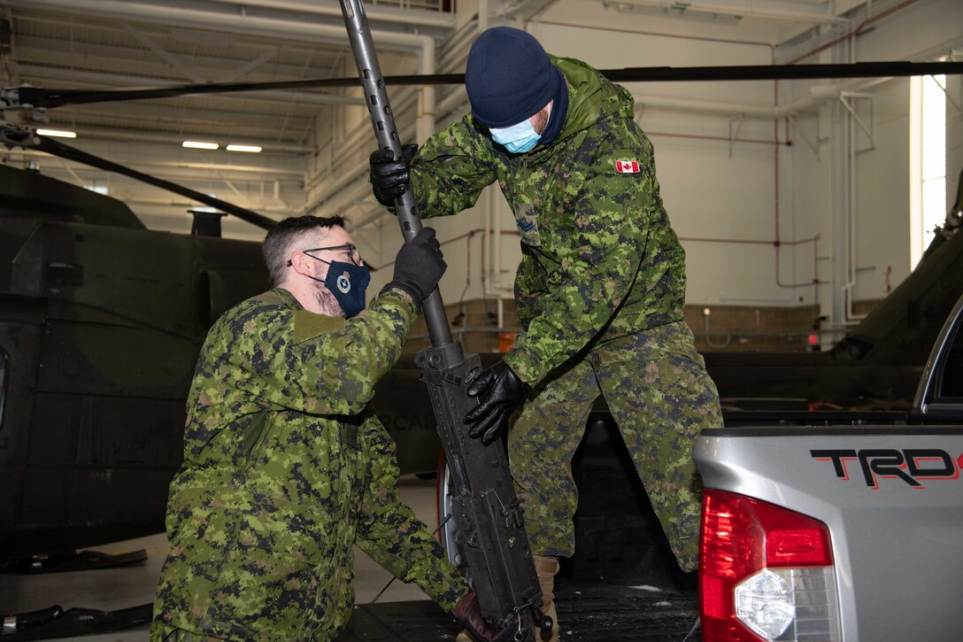Canadian Cpl. Graham Hall and Cpl. Steven Ames, Material Management Technicians with 408 Tactical Helicopter Squadron offload .50 caliber machine guns for aircraft preparation during Joint Pacific Multinational Readiness Center 22-02 at Ft. Wainwright, AK, February 28th, 2022.



JPMRC 22-02 is the first Regional Combat Training Center rotation in Alaska. It focuses on Large Scale Combat Operations (LSCO) and is a Cold Weather training event that includes a Situational Training Exercise (STX) and a Live Fire Exercise (LFX) in 2QFY22. This exercise will validate the 1/25th Stryker Brigade Combat Team’s Cold Weather training readiness and capabilities.



Photo Credit: Cpl. Angela Gore, Canadian Armed Forces
