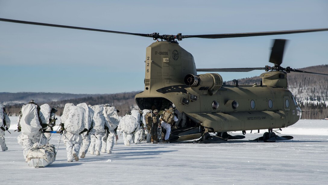 An American CH47 Chinook transports Canadian members of Royal 22e Régiment during Joint Pacific Multinational Readiness Center 22-02, Fort Wainwright, Alaska on March 16th, 2022. JPMRC 22-02 is the first Regional Combat Training Center (CTC) rotation in Alaska. It focuses on Large Scale Combat Operations (LSCO) and is a Cold Weather training event that includes a Situational Training Exercise (STX) and a Live Fire Exercise (LFX) in 2QFY22. This exercise will validate the 1/25th Stryker Brigade Combat Team’s Cold Weather training readiness and capabilities



Photo credit: Corporal Angela Gore, Canadian Armed Forces