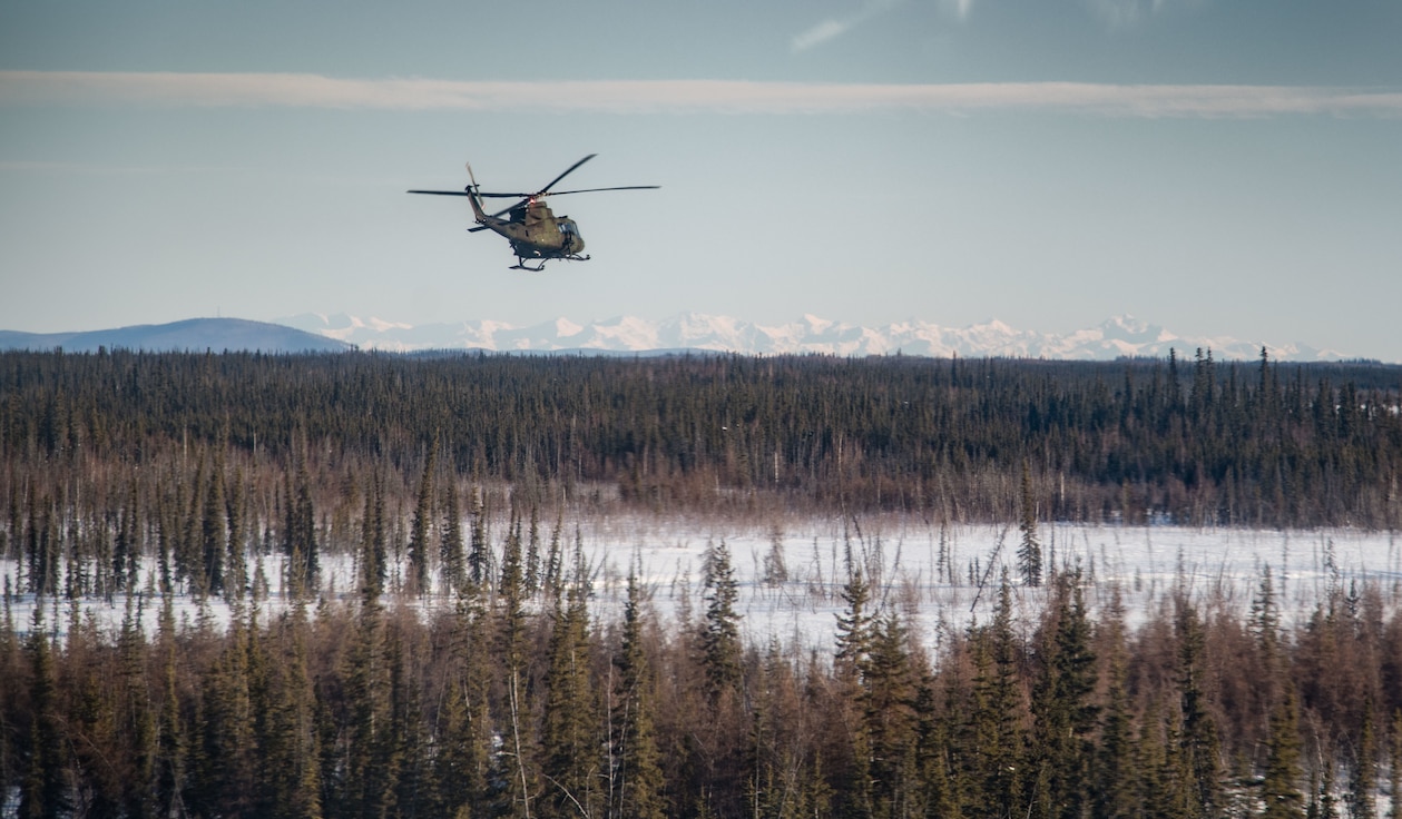 A CH146 Griffon helicopter flies along the eastern Alaska Mountain Range at Joint Pacific Multinational Readiness Center 22-02, Fort Wainwright, Alaska on March 14th, 2022. JPMRC 22-02 is the first Regional Combat Training Center (CTC) rotation in Alaska. It focuses on Large Scale Combat Operations (LSCO) and is a Cold Weather training event that includes a Situational Training Exercise (STX) and a Live Fire Exercise (LFX) in 2QFY22. This exercise will validate the 1/25th Stryker Brigade Combat Team’s Cold Weather training readiness and capabilities.



Photo credit: Corporal Angela Gore, Canadian Armed Forces