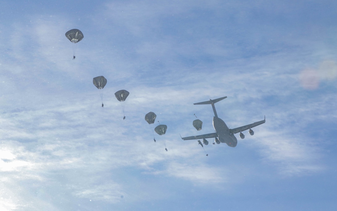 Paratroopers from the 1st Battalion, 501st Parachute Infantry Regiment, part of 4th Brigade, 25th Infantry Division assigned to United States Army Alaska, conduct a Joint Forcible Entry Operation onto Donnelly Drop Zone near Fort Greely, AK March 11, 2022 as part of Joint Pacific Multinational Readiness Center 22-02. JPMRC 22-02, executed in Alaska with its world-class training facilities and its harsh Arctic environment, builds Soldiers and leaders into a team of skilled, tough, alert, and adaptive warriors capable of fighting and winning anywhere. (Staff Sgt. Christopher B. Dennis/USARAK Public Affairs NCO)