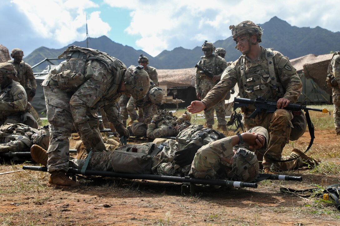 U.S. Army Soldiers from 524th Division Sustainment Support Battalion, 25th Sustainment Brigade, 25th Infantry Division, are conducting medical evacuation training during Joint Pacific Multinational Readiness Center (JPMRC) training on Schofield Barracks, Hawaii, on Oct. 31, 2022. JPMRC 23-01 is a regional combat training center (CTC) rotation that builds combat readiness in America's Pacific Division and is a key way the Army forces engage in a joint environment with our regional allies and partners. (U.S. Army photo by Pvt. Anastasiya Ludchenko)