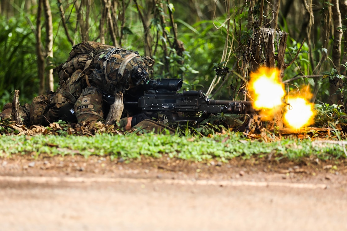 A Soldier from the 25th Infantry Division returns fire from opposition forces during the Joint Pacific Multi-National Readiness Center rotation 22-01 exercise on Oct. 25, 2021 on Kahuku Training Area, Hawaii. JPMRC Rotation 22-01 provides the 25th Infantry Division the opportunity to integrate and train alongside our partners and allies throughout the Indo-Pacific Region. (U.S. Army photo by Sgt. Carlie Lopez/28th Public Affairs Detachment)