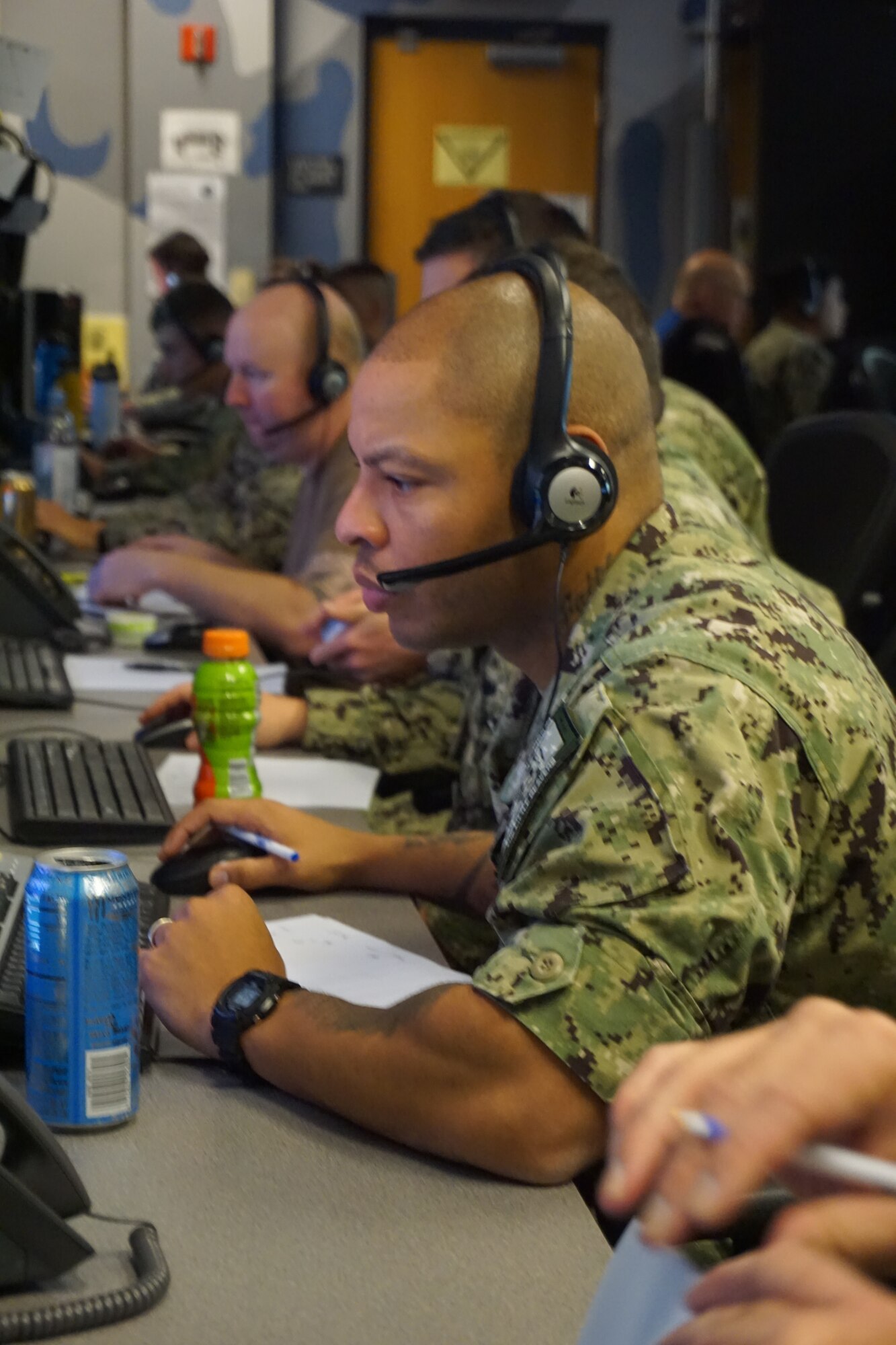 military members working at computers