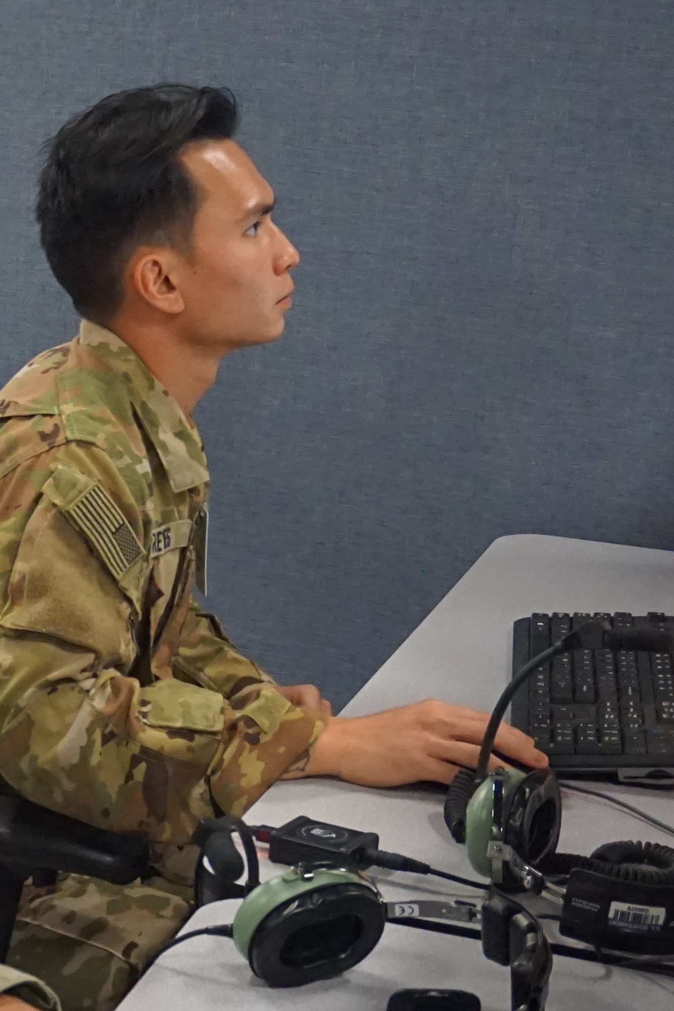 military member working at computer