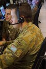 military members working at computers