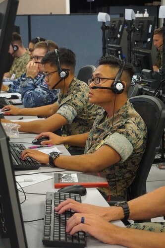 military members working at computers