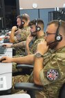 military members working at computers