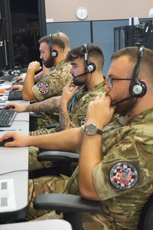military members working at computers