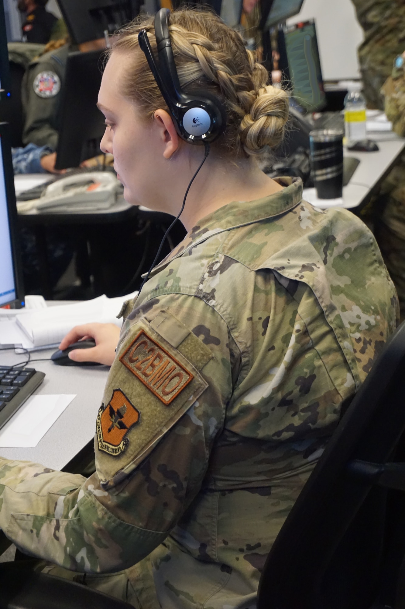military member sit working at a computer