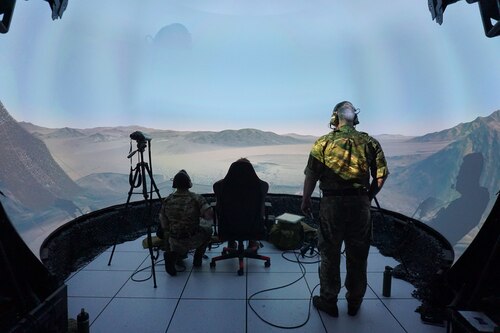 three military members working in a virtual environment