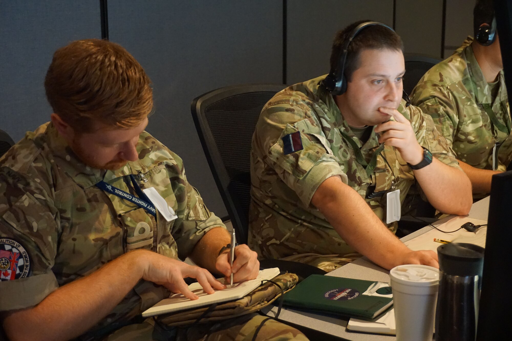 military members working at computers