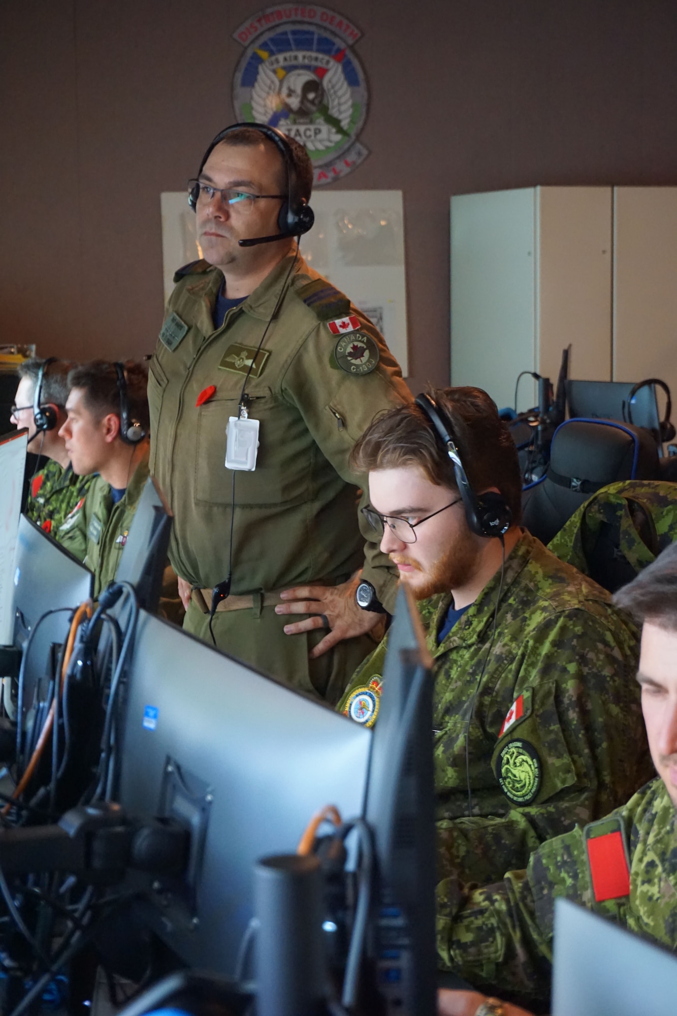 military members working at computers