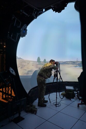 military member using binoculars in virtual environment