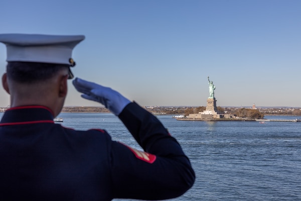 U.S. Marine Cpl. Abel EucedaVillatoro, an Assault Amphibious Vehicle Technician with 2nd Maintenance Battalion, Combat Logistics Regiment 27, 2nd Marine Logistics Group, renders honors during Veterans Day Parade 2022 on the USS Arlington (LPD 24) on Nov. 9, 2022. Veterans Day New York is an annual public event that celebrates those who served and are currently serving in the U.S. military. (U.S. Marine Corps photo by Sgt. Christian M. Garcia)