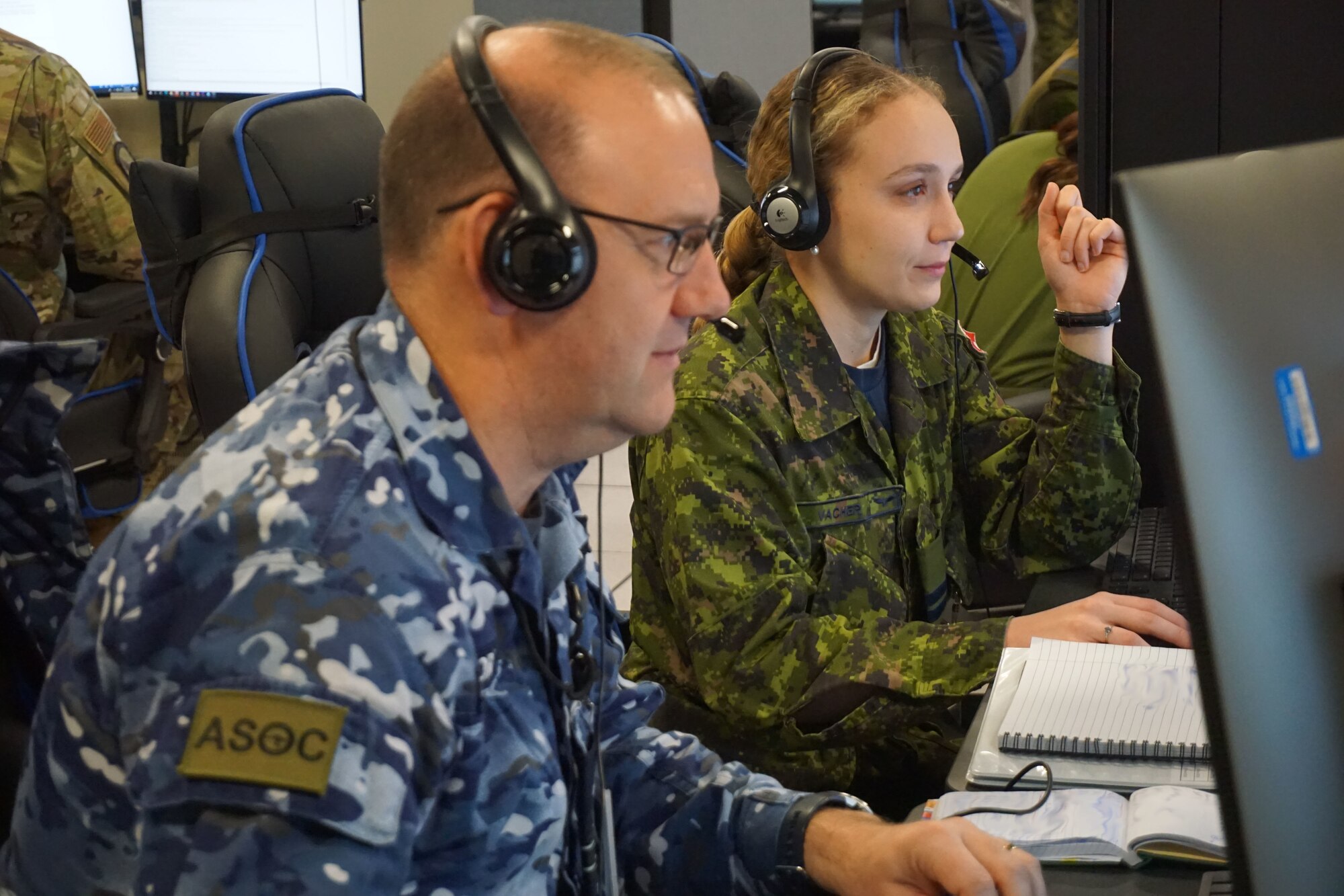 military members working at computers