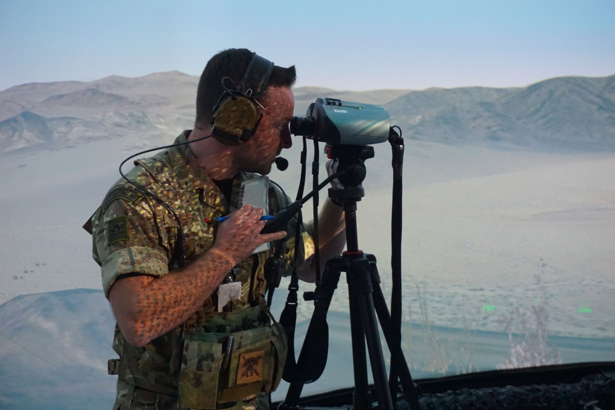 military member using binoculars in virtual environment
