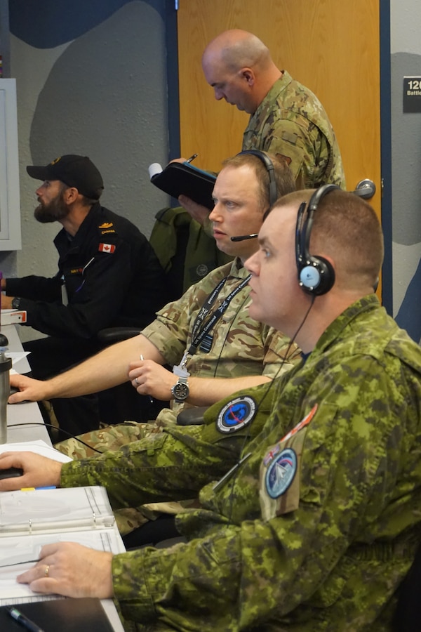 U.S. Space Force, United Kingdom Space Command, Royal Canadian Navy, and Royal Canadian Air Force (Space) participating in VIRTUAL FLAG: Coalition 23-1 in the Air Operations Center, at the 705th Combat Training Squadron, also known as the Distributed Mission Operations Center, at Kirtland Air Force Base, New Mexico, and distributed sites across four countries, Oct. 24 – Nov. 4, 2022. Exercise VFC serves as a train as you fight exercise by integrating the full spectrum of air, land, surface, space, and cyber warfighters in a virtual battlespace in joint and coalition environments; forces from the United States, United Kingdom, Australia, and Canada participated. (U.S. Air Force photo by Ms. Deb Henley)