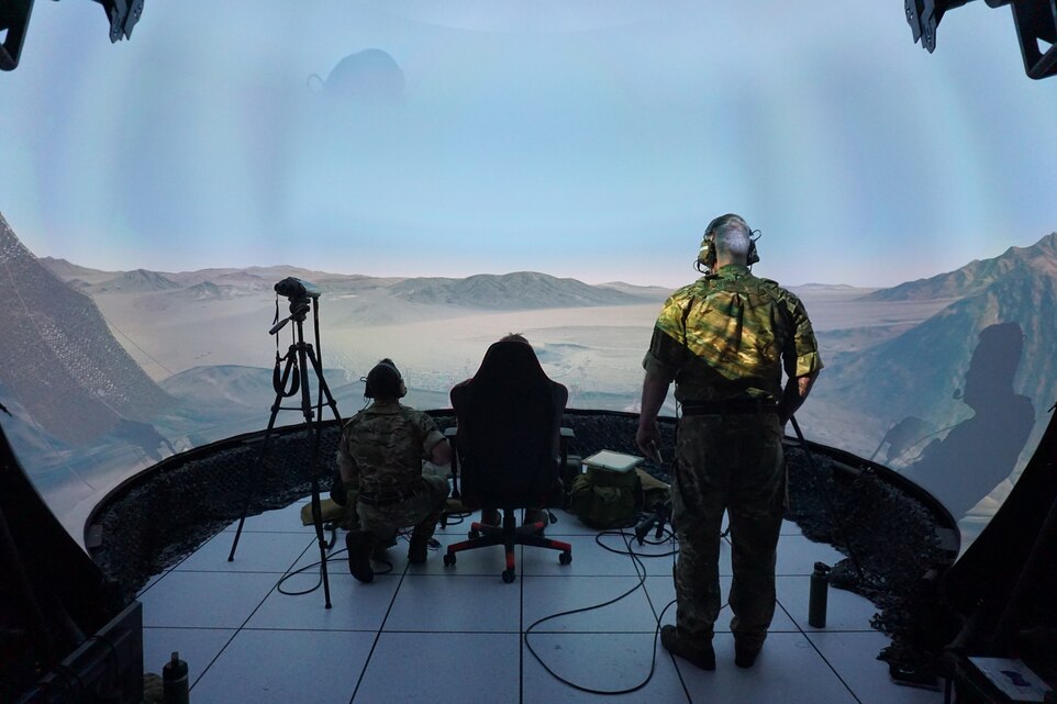 three military members working in a virtual environment