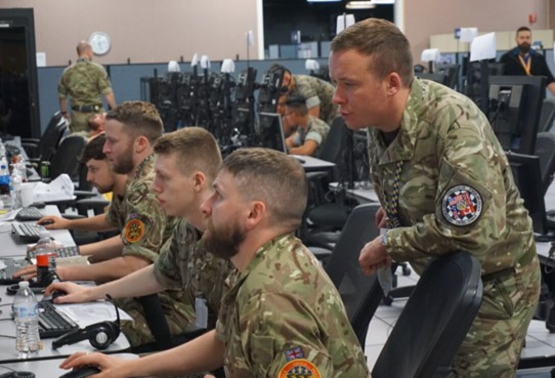 military members working at computers