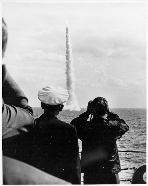 During a visit aboard the USS Observation Island (EAG 154), President John F. Kennedy witnesses the successful launch of an unarmed Polaris A2 missile from the LAFAYETTE Class submarine USS Andrew Jackson (SSBN 619) off the coast of Florida.
