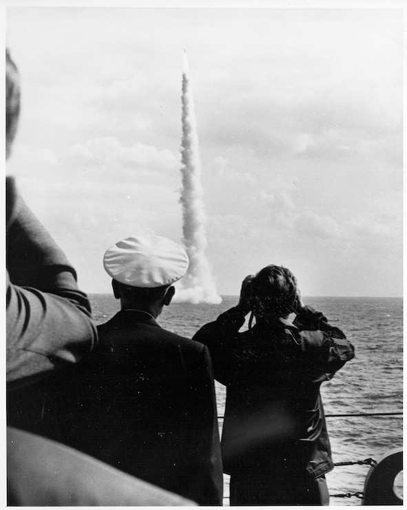 During a visit aboard the USS Observation Island (EAG 154), President John F. Kennedy witnesses the successful launch of an unarmed Polaris A2 missile from the LAFAYETTE Class submarine USS Andrew Jackson (SSBN 619) off the coast of Florida.
