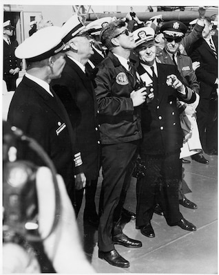 During a visit aboard the USS Observation Island (EAG 154), President John F. Kennedy witnesses the successful launch of an unarmed Polaris A2 missile from the LAFAYETTE Class submarine USS Andrew Jackson (SSBN 619) off the coast of Florida.