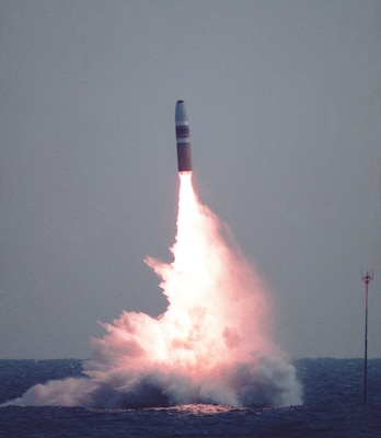 An unarmed Trident I C4 missile launches from the fleet ballistic missile submarine USS Daniel Boone (SSBN 629) off the coast of Cape Canaveral, Florida. Development on the Trident I C4 missile began in 1975 along with the construction of the first submarine to be fit for the Trident missile body.