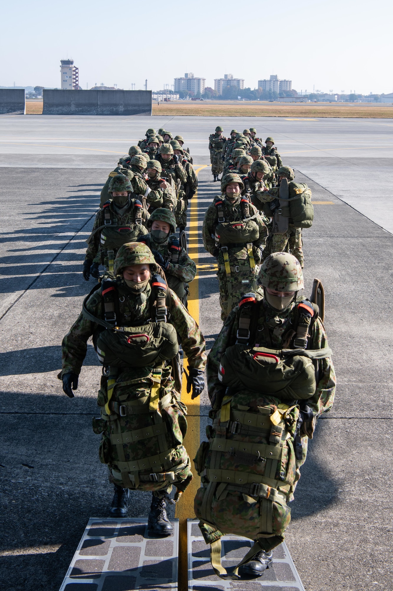 Soldiers from the Japan Ground Self-Defense Force, 1st Airborne Brigade, boarded a 36th Airlift Squadron C-130J Super Hercules for a joint jump training starting at Yokota Air Base, Japan, Nov. 10, 2022.